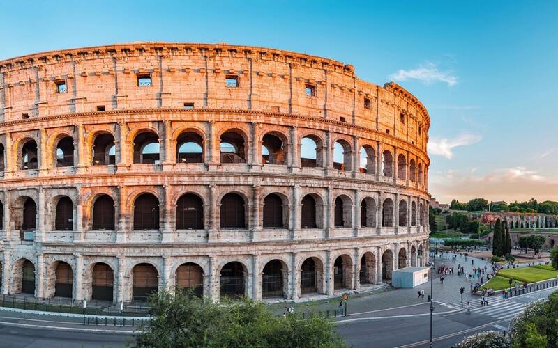 Sunset view of Rome's Colosseum, symbolizing ancient grandeur.