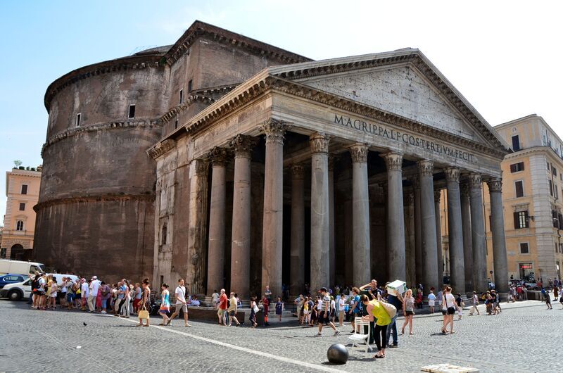 Tourists gather at Rome's Pantheon, a historic marvel.